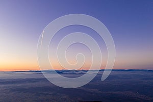 Zagreb Skyline in Croatia. Sunset Light Colorful Sky in Background. View from the top of Medvednica Mountain.  Haze Background