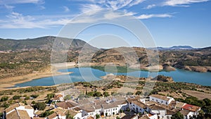 The Zahara-El Gastor Reservoir and the white village Zahara de la Sierra in the Cadiz province of Spain. photo