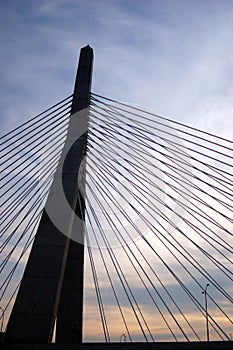 The Zakim Bridge in Boston is silhouetted at sunset