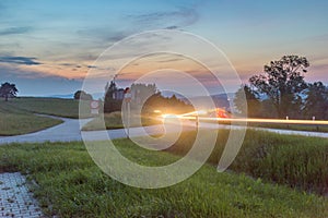 Zakopianka road with car light trail in Chabowka at susnet time