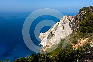 Zakynthos Island, Greece. View on horizon, rocky shore and turquoise, crystal clear waters of Ionian Sea