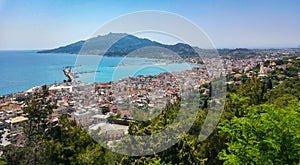 Zakyntos city and port from top panorama view, with the blue sky, sea, and mountain in background