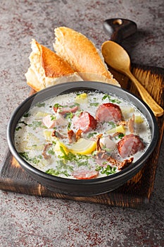 Zalewajka is a traditional Polish soup made from whole wheat soup starter, smoked sausage, aromatic smoked bacon and root