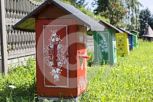 Painted old wooden beehives decorated with a hand painted colorful flowers, Zalipie, Poland