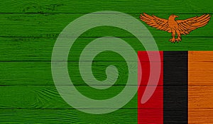 Zambia flag on a wooden texture.