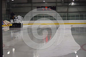 Zamboni clearing out an ice rink photo