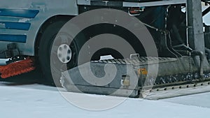 Zamboni resurfacing an indoor skating rink. Slow Motion. Ice resurfacer cleaning ice, resurfacer machine cleaning and