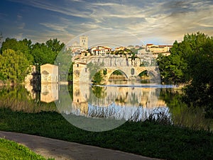 Zamora old town seen form Douro river, Acenas and stone bridge in the foreground, Cathedral in background, Spain