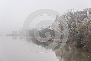 Watermills of Zamora and the Douro river in a foogy day photo