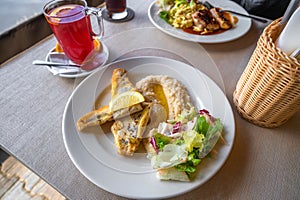 Zander fillet with chickory and parsley puree, drink and second meal