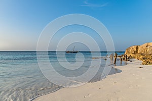 Zanzibar, Tanzania - February 8. 2020: Sunset time at the beach of Nungwi with people walking around