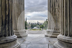Zappeion, Athens - Greece. Looking through the columns of the Zappeion Megaron we see the park in front of it with the fountain an