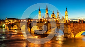 Zaragoza city, Spain, bridge and Cathedral del Pilar at sunset