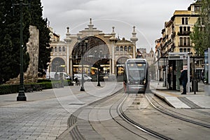 Zaragoza tram makes its stop at the market in the city center.