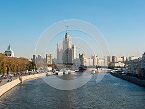 Zaryadye park, floating bridge. View of the Moscow River and the Stalin skyscraper on the Kotelnicheskaya embankment on an autumn