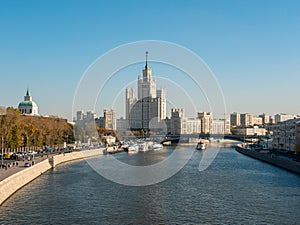 Zaryadye park, floating bridge. View of the Moscow River and the Stalin skyscraper on the Kotelnicheskaya embankment on an autumn