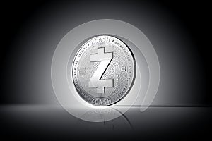 Zcash cryptocurrency physical concept coin on gently lit dark background.