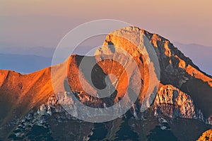 Zdiarska Vidla peak of Belianske Tatras enlighted by sunset light during autumn