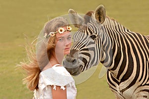 A Zebra and a beautiful girl