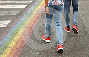 Zebra crossing and a rainbow flag on the road. lgbt