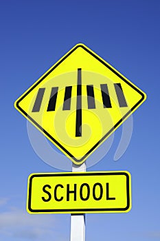 Zebra crossing road sign with school