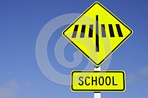 Zebra crossing road sign with school