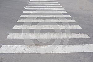 Zebra crosswalk on the road for safety when people walking cross the street