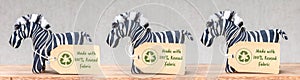Zebra toys with Made with 100 percent reused fabric label and recycle textiles icon symbol