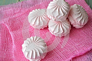 Zefir. Pink and white marshmallow zefir hand made. On pink napkin background