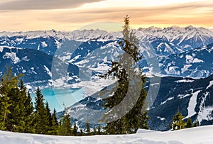 Zell am See at Zeller lake in winter. View from the Mountain Schmittenhohe, snowy slope of ski resort in the Alps