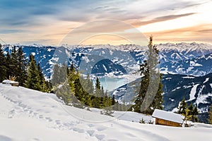 Zell am See at Zeller lake in winter. View from the Mountain Schmittenhohe, snowy slope of ski resort in the Alps