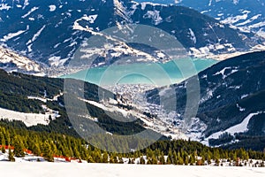 Zell am See at Zeller lake in winter. View from the Mountain Schmittenhohe, snowy slope of ski resort in the Alps