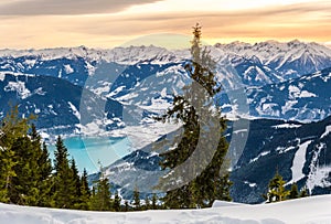 Zell am See at Zeller lake in winter. View from the Mountain Schmittenhohe, snowy slope of ski resort in the Alps photo