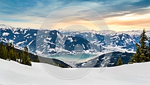 Zell am See at Zeller lake in winter. View from the Mountain Schmittenhohe, snowy slope of ski resort in the Alps photo