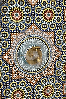 Zellige ceramic tiles on wall with water tap in Morocco