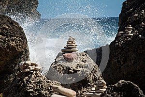 Zen balanced rocks with backdrop of water splash