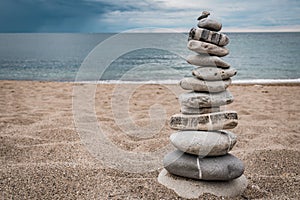 Zen balanced stack of stones on beach