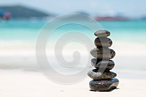 Zen Balancing Pebbles on Beach