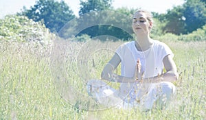 Zen beautiful young yoga woman breathing, soft vintage toned effects