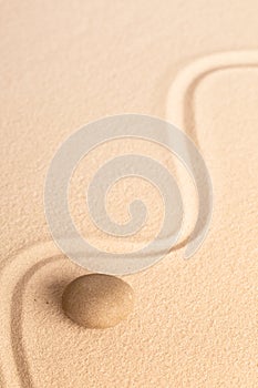 Zen Buddhism, meditation and relaxation stone in raked Japanese sand garden