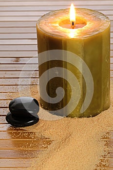 Zen candle and black stone