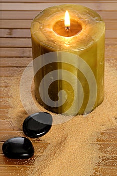 Zen candle and black stone