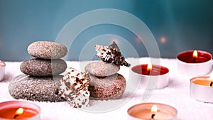 Zen concept, spa pebbles stones and burning aroma candles sea shells, Treatment aromatherapy and massage copy space