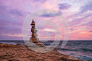 Zen concept. Sunset. The object of the stones on the beach at sunset.  Relax & Meditation.