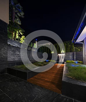 Zen garden with a fountain at night, nobody