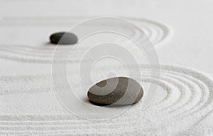 Zen Garden with Grey Stone on White Sand Line Texture Background, Top View Black Rock Sea Stone on Sand Wave Parallel Lines