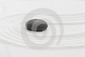 Zen Garden with Grey Stone on White Sand Line Texture Background, Top View Black Rock Sea Stone on Sand Wave Parallel Lines