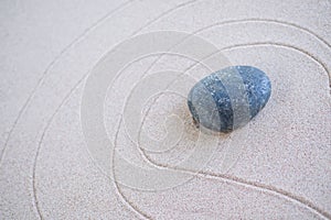 Zen Garden Japanese pattern on white sand background.