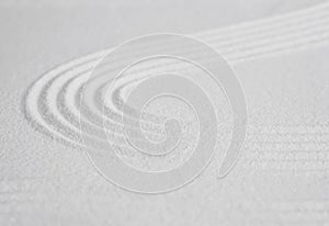 Zen garden with line pattern on white sand in Japanese style, Sand texture surface with wave parallel lines,Background banner for