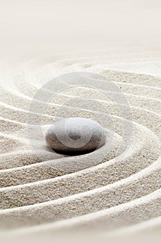 Zen garden meditation stone background with stones and lines in sand for relaxation